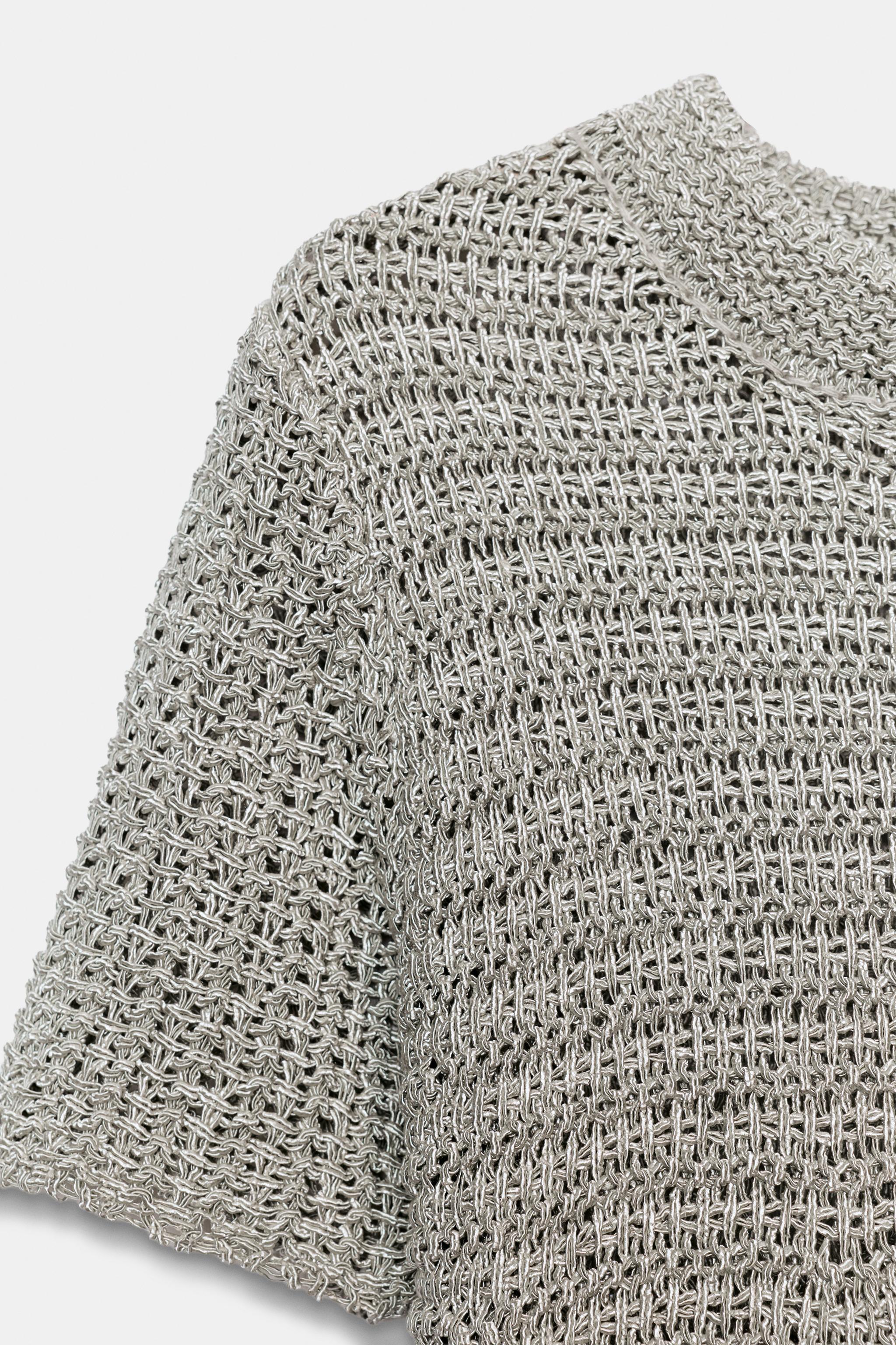 OPEN-KNIT PEPLUM TOP